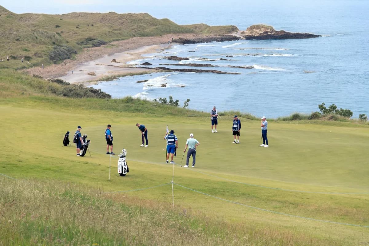A heathland golf course in Scotland with golden fairways under dramatic open skies