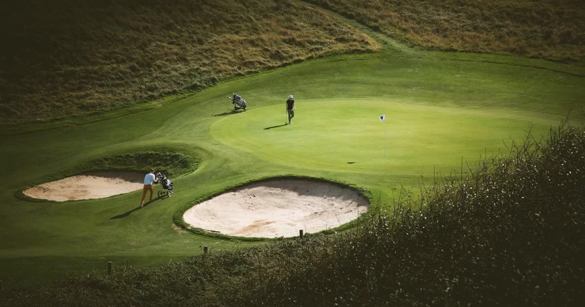 A well-maintained golf course in the south west of England with rolling hills in the background