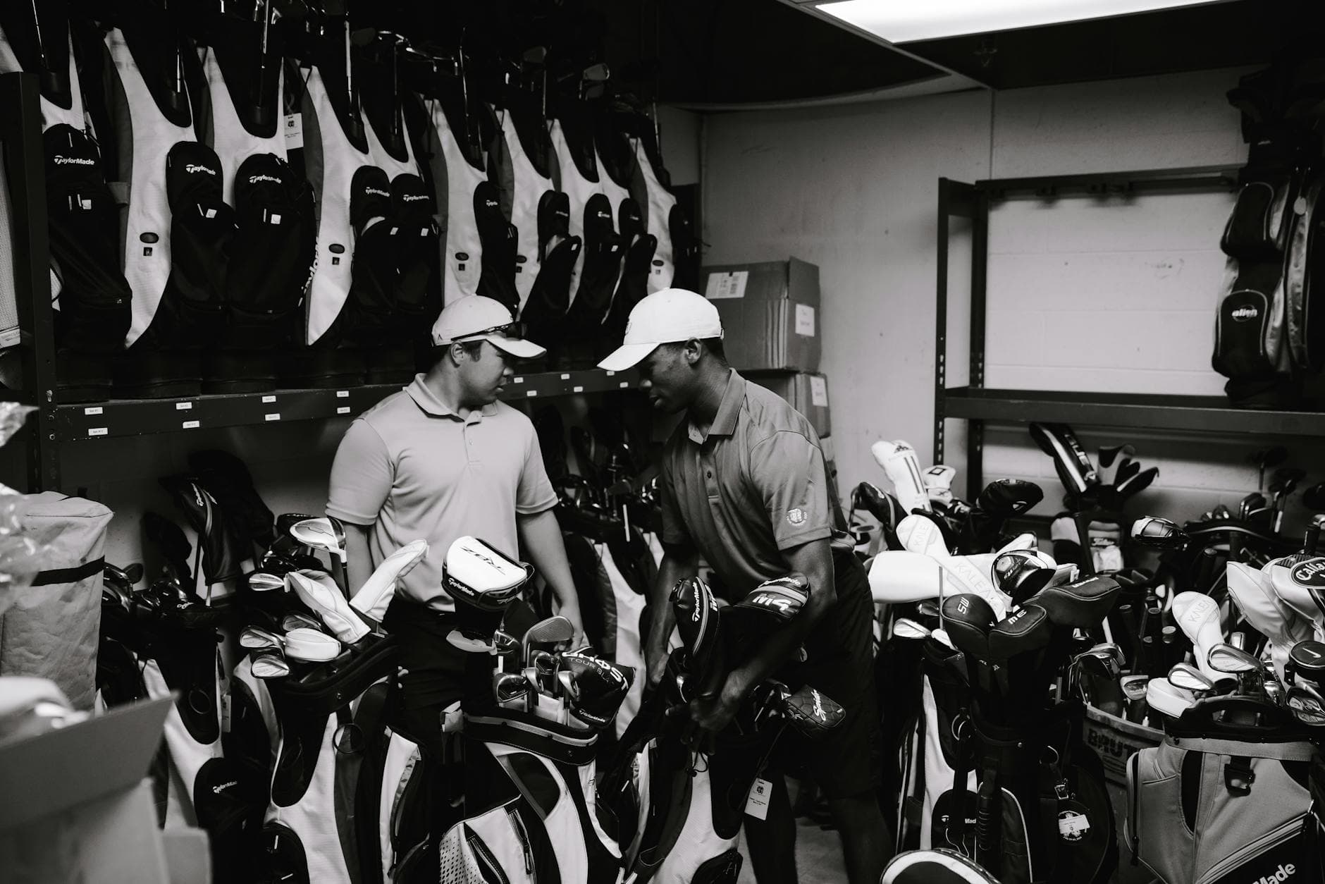 A selection of golf clubs leaning against a golf bag on a course