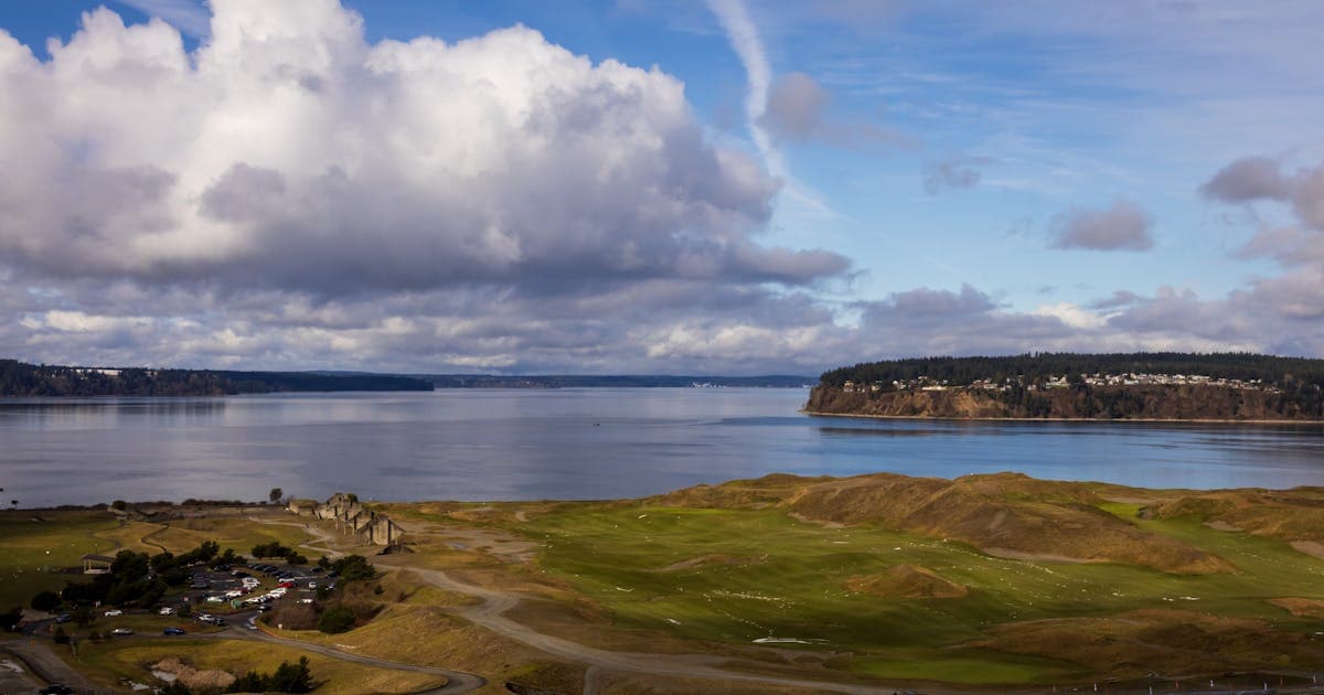 A links golf course on the Welsh coast with sea views and dramatic skies