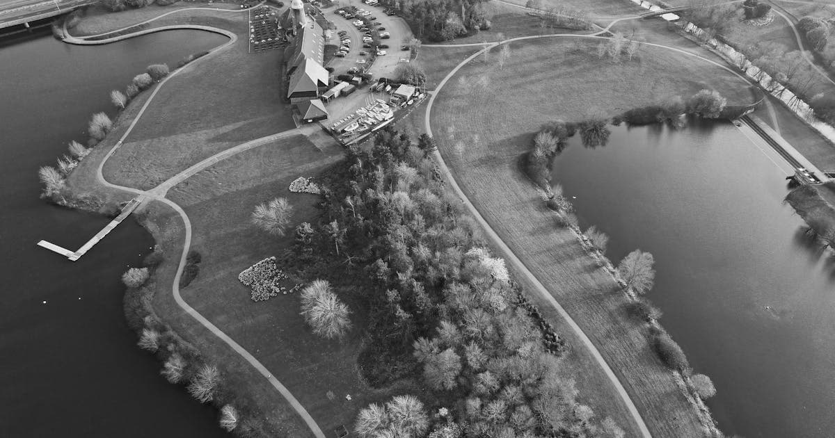 Aerial view of a hidden gem golf course surrounded by lush English countryside