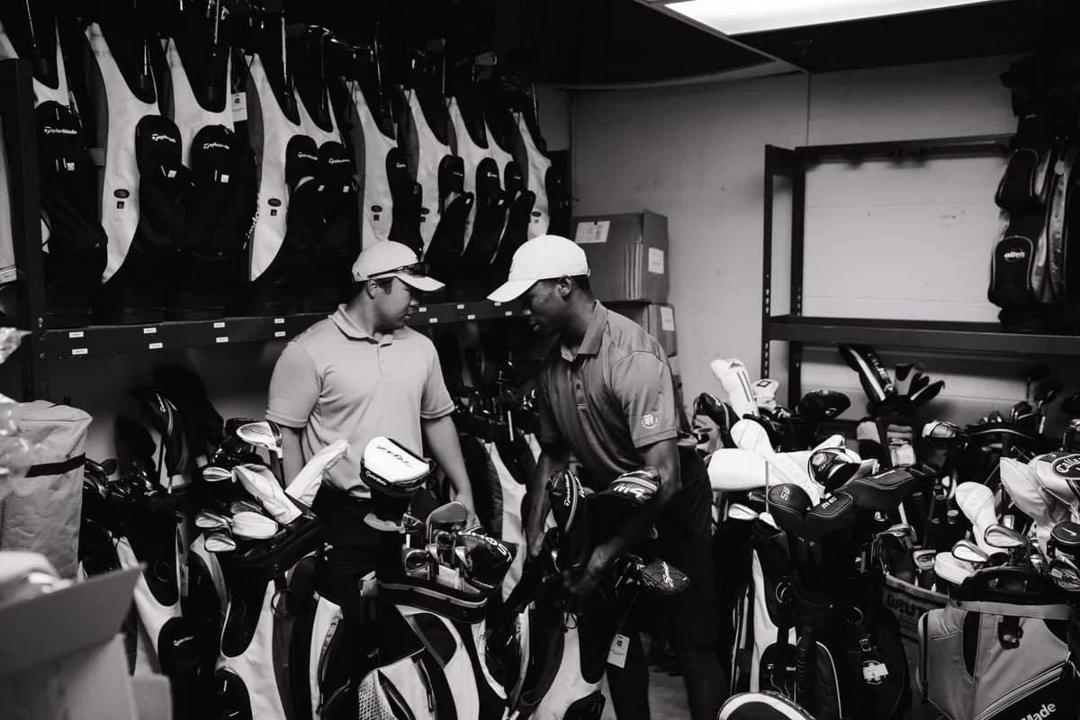 Golf clubs, bag and accessories laid out ready to buy
