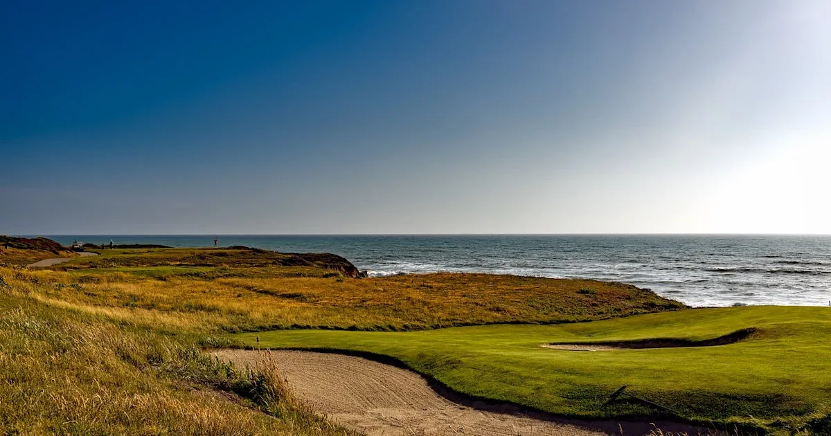 Stunning coastal golf course in Scotland with blue sky overhead