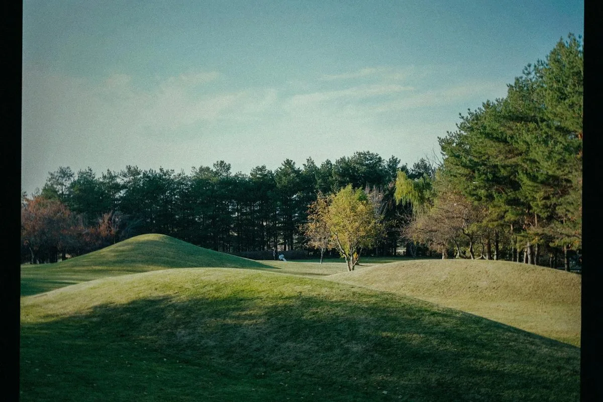 A well-maintained golf course in the south west of England with rolling hills in the background