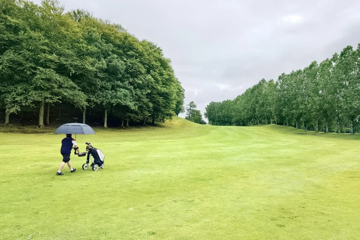 A manicured golf course fairway in the north west of England on a clear day