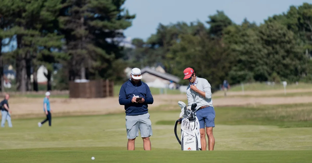 Two male golfers preparing for a round on a sunny Scottish golf course