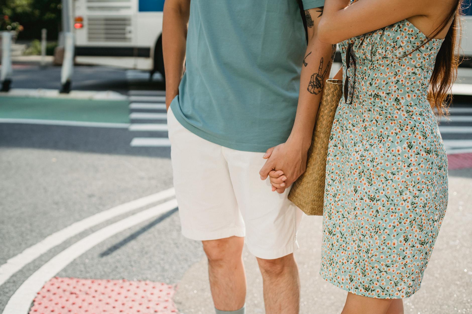 A couple walking together on a golf course on a sunny day