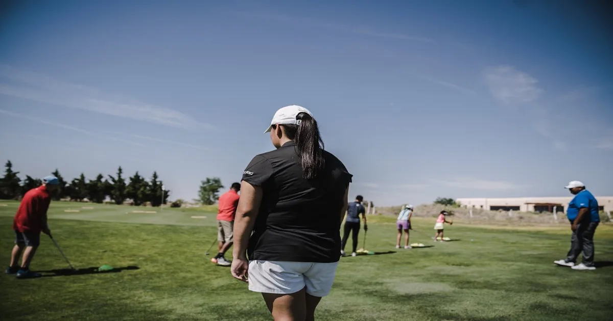 Two golfers walking together on a scenic golf course at golden hour