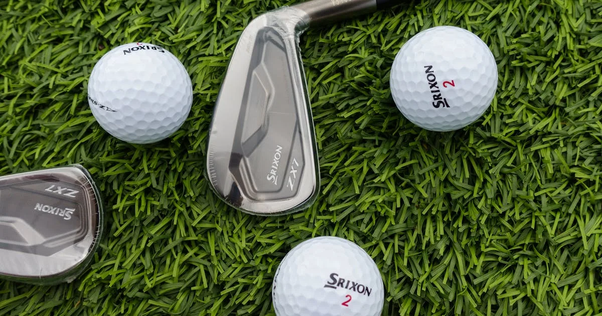Close-up of a golf ball on a tee with a fairway stretching into the distance