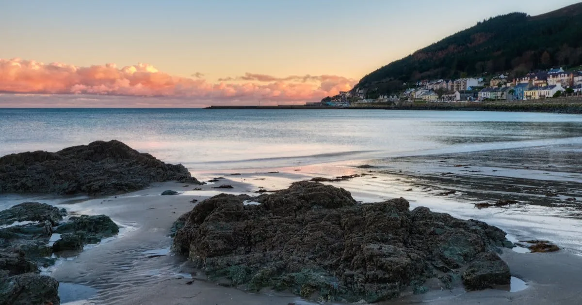 The Mourne Mountains rising behind the coastline near Newcastle, County Down