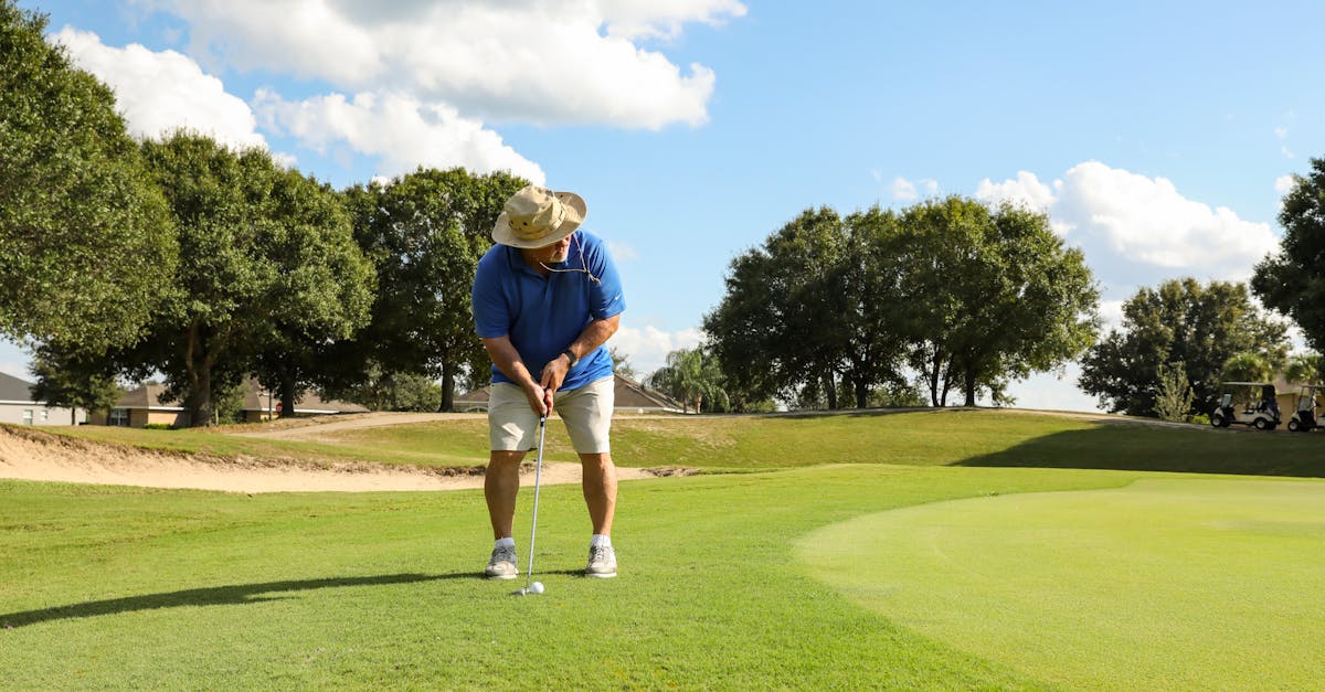 Sweeping parkland fairway at Royal Norwich Golf Club with mature trees and manicured greens in the Norfolk countryside