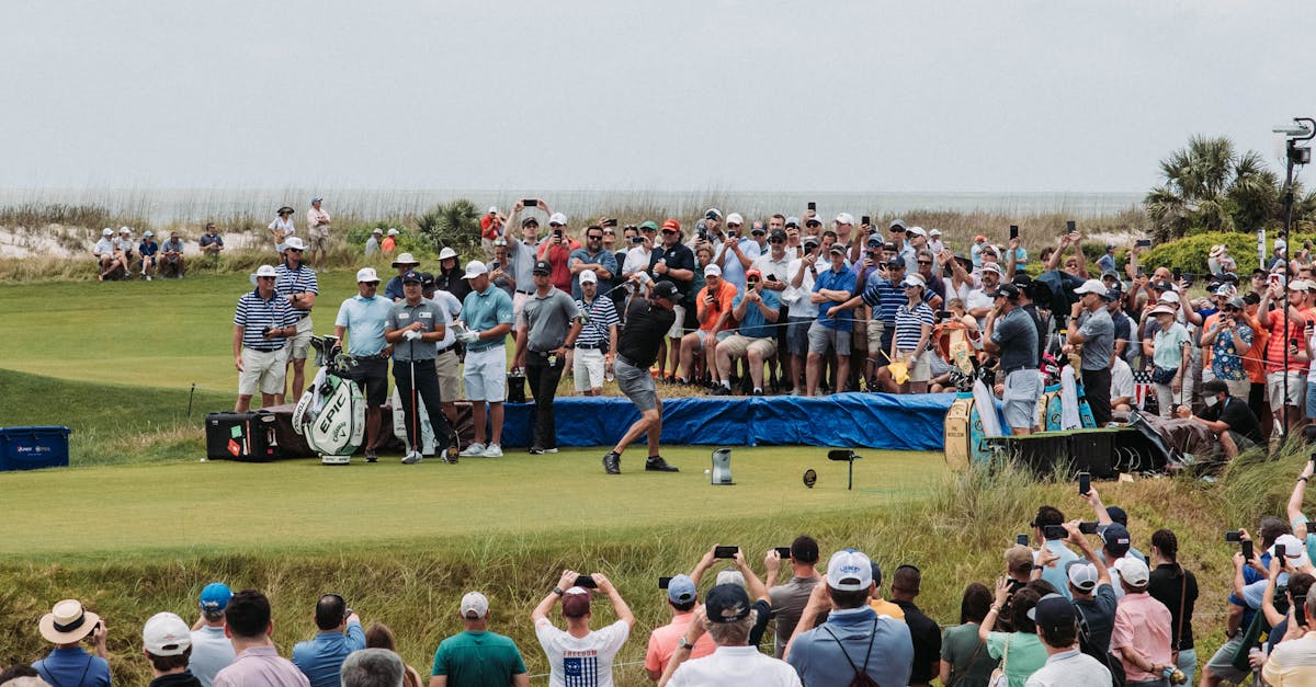Tree-lined heathland fairway at Stoneham Golf Club with heather bordering the rolling Hampshire course