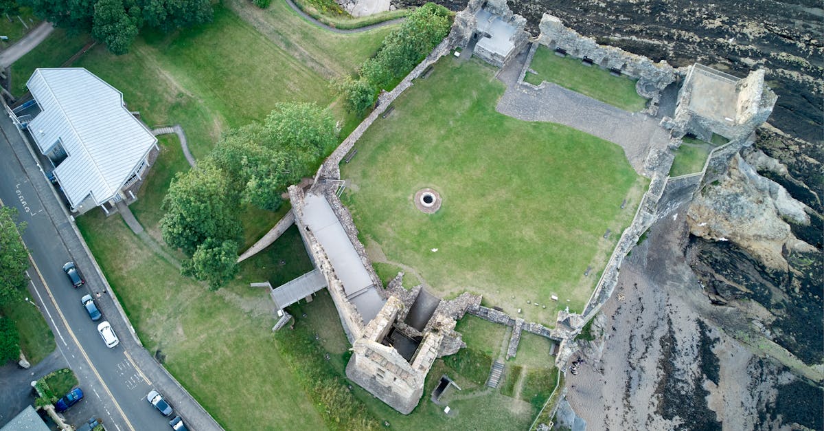 The iconic Swilcan Bridge on the Old Course at St Andrews with the R&A clubhouse in the background