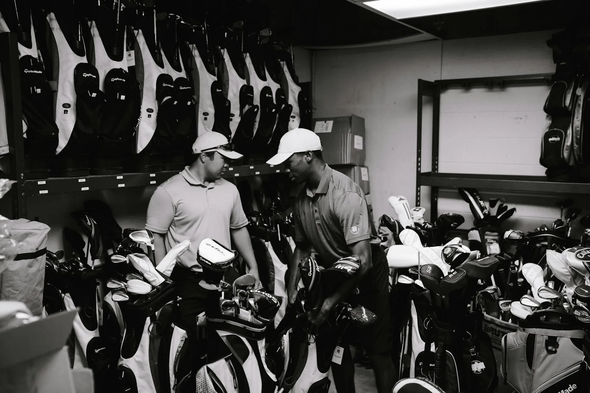 A selection of golf clubs leaning against a golf bag on a course